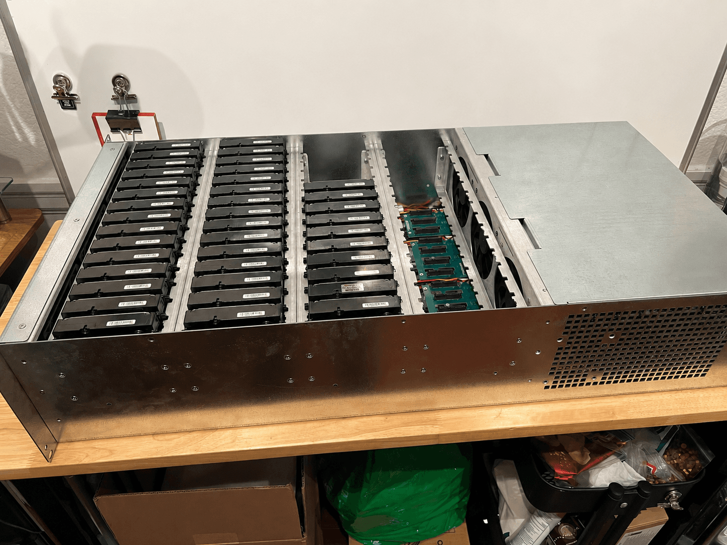 60-bay SATA storage chassis populated with drives, with the compute and backplane visible to the right.