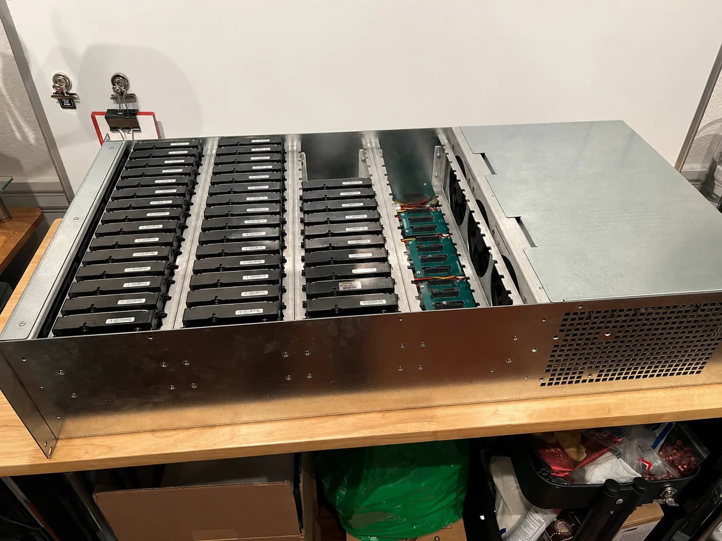 60-bay SATA storage chassis populated with drives, with the compute and backplane visible to the right.