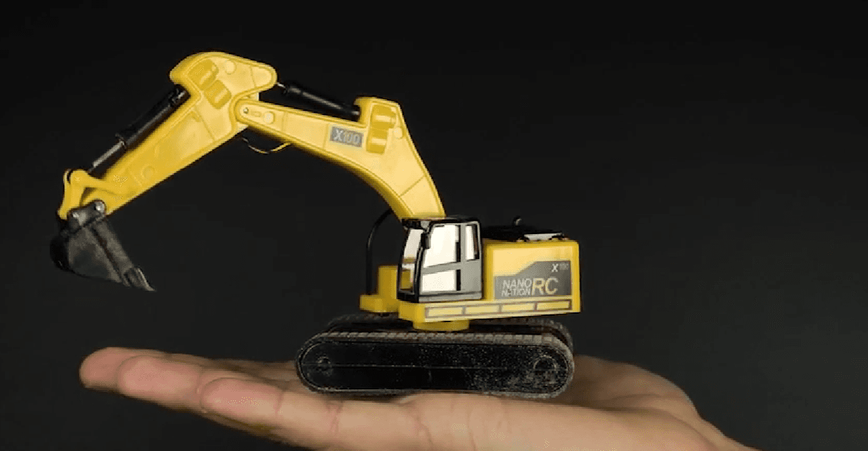 NANO X100 shown at 1:64 scale next to reference objects.