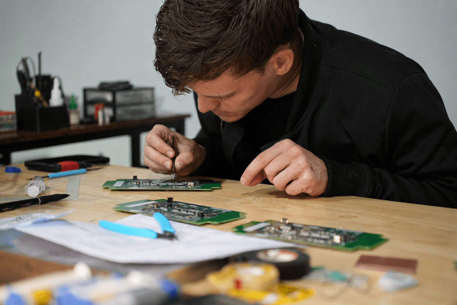 At the bench, building hardware.