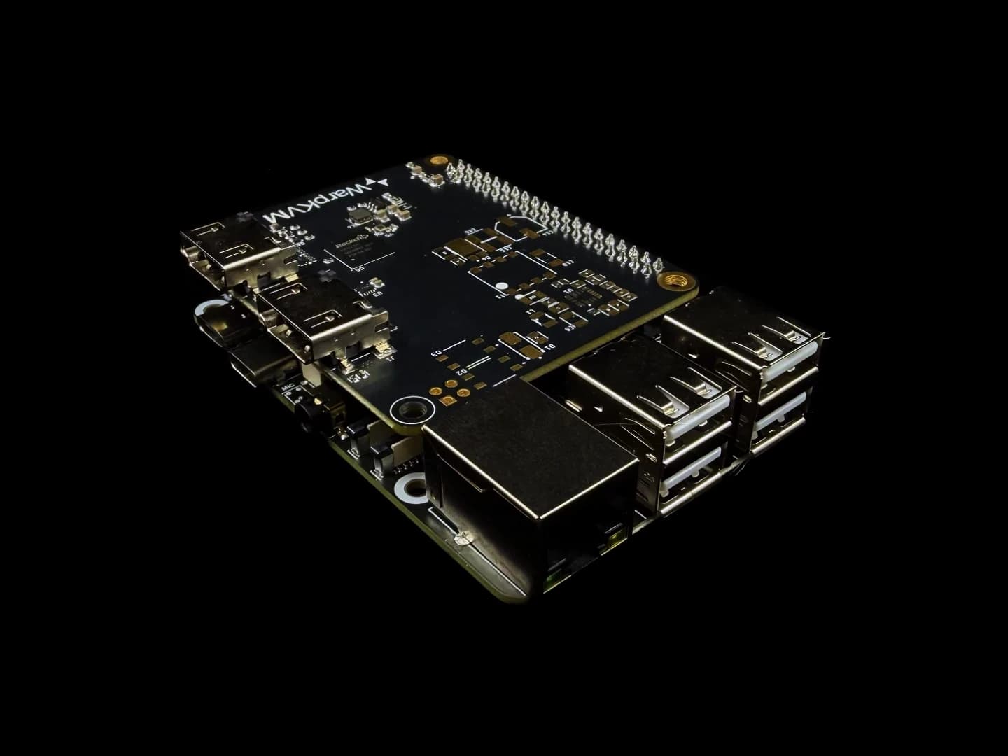 Photo of an assembled WarpKVM DIY kit: the RK628H carrier board stacked on the Luckfox Aura, seen from the Ethernet and USB corner.