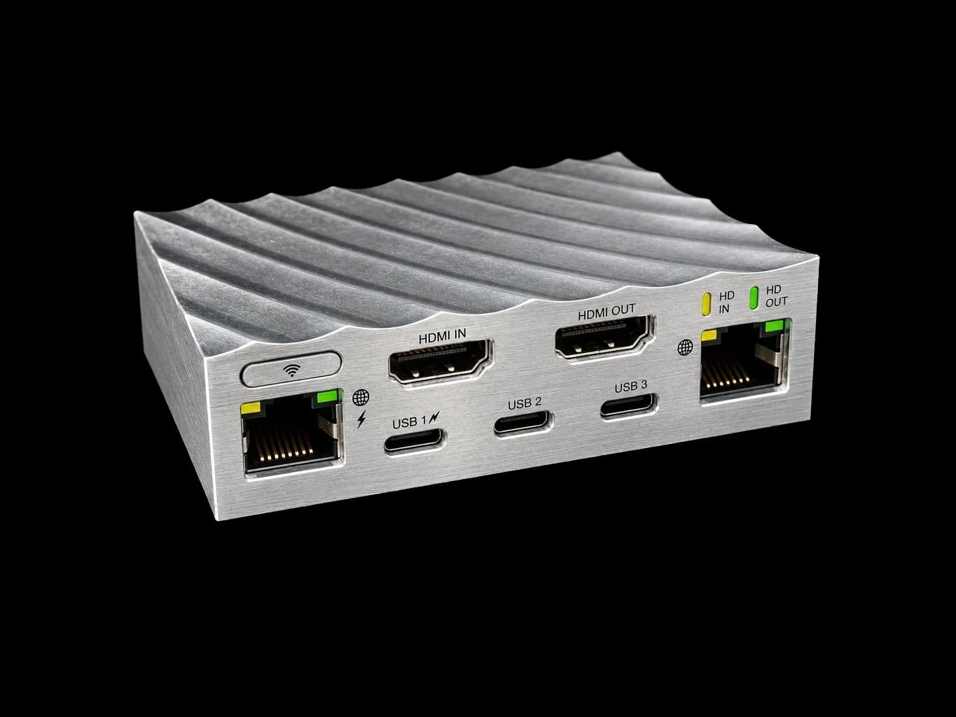 Render of the WarpKVM 01 connector face: two Ethernet, HDMI in and out, three USB-C, and the pairing button.